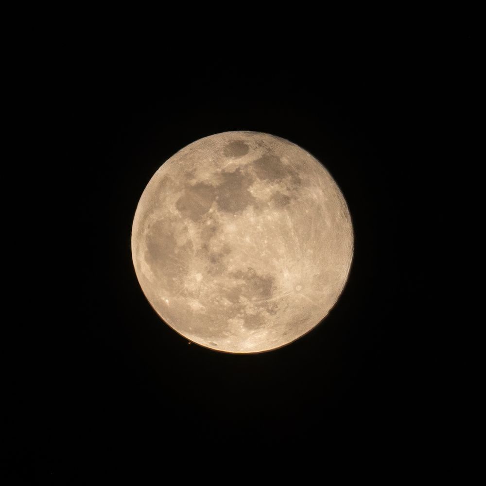 Mars and the Moon, pre-occultation - Mars is the tiny red dot near the lower left edge of the Moon.