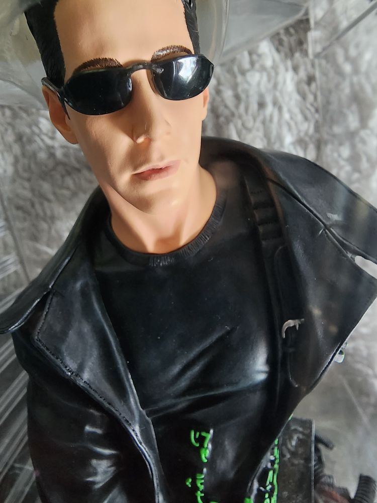 It's a bust statue of Neo from the Matrix
