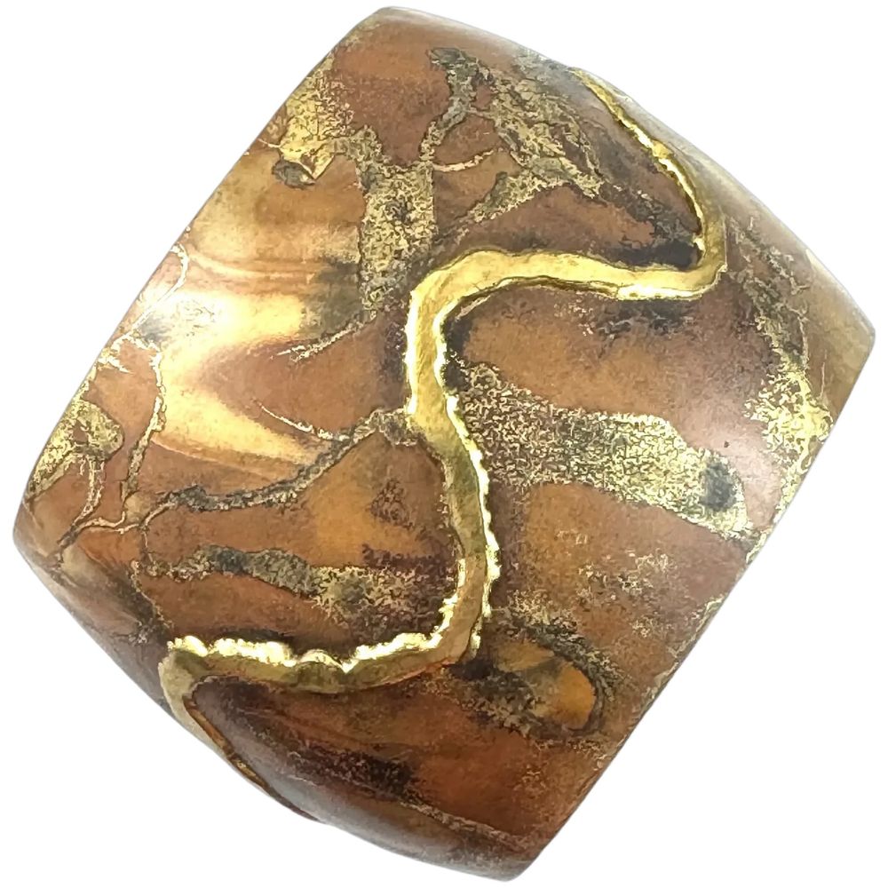 A huge vintage 1960s 70s one of a kind handmade mixed metals (copper, brass) and heavily patinated abstract modernist design cuff bracelet by studio jeweler Lascaux from Quebec, Canada. Entirely handmade no doubt one of a kind creation by a talented designer and craftsman! The copper has a zig zag line of brass/bronze laid overtop, and the copper has been heavily patinated in various colors, and with gold and silver spiderweb lace-like designs in spots! Really quite complex design exquisitely handmade! Measures 2" wide and fits up to a 7" wrist presently, although it could be easily adjusted up a few sizes if desired. Marked at one end, "Lascaux" for the artisan-jeweler from Quebec. There is one spot on the bracelet where the design has cut-thru in a ragged sort of opening. This is original, not damage, and I'm guessing part of the original design (see my closeup photos). A spectacular one of a kind piece of vintage wearable art! Excellent vintage condition.