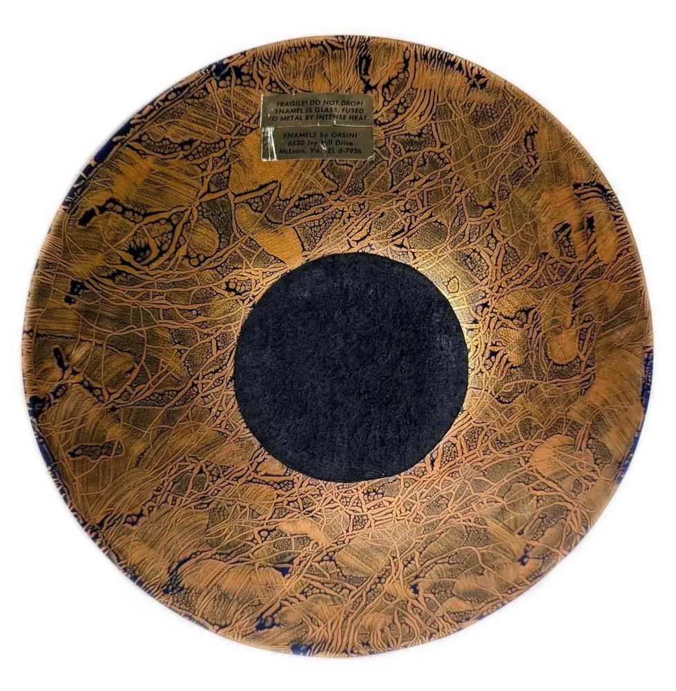 Gwendolyn Anderson, world-renowned artist and enamelist, was born on May 31, 1912, in Riverside, Illinois. Gwen began her artistic career in watercolors, inspired and encouraged by her parents. Her artwork was exhibited at the Corcoran Gallery of Art and other galleries, both public and private. In the early 1950’s, Gwen discovered enameling. She was a self-taught artist, experimenting and developing new and creative enameling techniques. Throughout her lifetime, Gwen held numerous one-woman shows and garnered multiple awards. In 1973, Gwen organized the first enamelist guild in the United States, the National Enamelists Society. Gwen was part of the team of artist volunteers and city personnel in 1974 opening the doors of the Torpedo Factory Art Center in Alexandria, VA. She was a founding member of the Enamelists Gallery located in the art center, and continued to work at the gallery over the next 30 years. Gwen never grew tired of exploring new horizons. She continued traveling the world, visiting over 100 countries, drawing inspiration from the people and cultures. Gwen combined education and travel through participation in the Elder hostel program. Always eager for new adventures, at age 80 she joined Global Volunteers and traveled over the next several years teaching English and building schools for children in Viet Nam, Turkey, Greece and other countries.
A painter, enamel craft worker, teacher and art dealer, she was known as Gwendolyn Orsinger Anderson and later simply as Orsini. Orsini studied at the University California, Los Angeles, 1934-35; University Illinois. (B.S., 1937); Art Institute of Chicago; Norton Gallery & School Art; Eliot O'Hara; University Virginia., 1955. In Illinois, she was Director of the Artist's Mart in 1954, and also was an art teacher at Pekin High School. In Clayton, New York, she was an enameling teacher including at 1,000 Island Museum Craft School in 1966-67; and Cross Creek Ceramics in 1972.