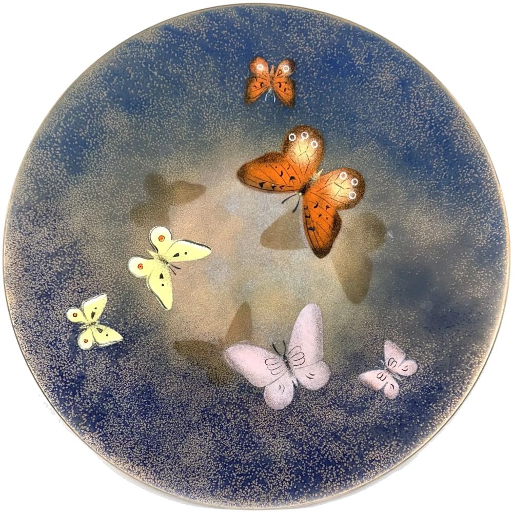 A huge vintage 1950s handmade multicolored copper enamel 'Butterflies are Free' enamel artwork by California artist Lily Alexander. The largest version of her 'butterflies' themed enamel artworks, and in pristine almost like-new condition! The design consists of three larger and three smaller butterflies circling the center, and their shadows underneath them against a mottled background that graduates from a mottled blue at the outer edges to a pinky-copper at center. One of Alexanders more feminine designs, though she obviously loved animals of all kinds as she so often depicted them in her work! She often associated her designs with popular movies of the time. I had another of hers titled "King of Siam" which depicted a regal Siamese cat. I am calling this one, "Butterflies are Free", though the romantic movie no doubt came after this artwork, but it seems an apt title. Lily Alexander was of Scottish/Japanese origin, and was the artistic half of the husband and wife team that included her and her husband, Paul Alexander. He was the marketing mind that ran the business while his wife handled all the design work and actual crafting of the pieces. They seem to have been primarily active during the 1950s and 60s. The tray measures 12" diameter by about 1" high at the rim. Has a hanging apparatus attached at back as shown, and marked "Hand Crafted in California by Alexander" as shown. There is also an intact sticker at back with a number, "713", perhaps a gallery note. In excellent vintage condition.