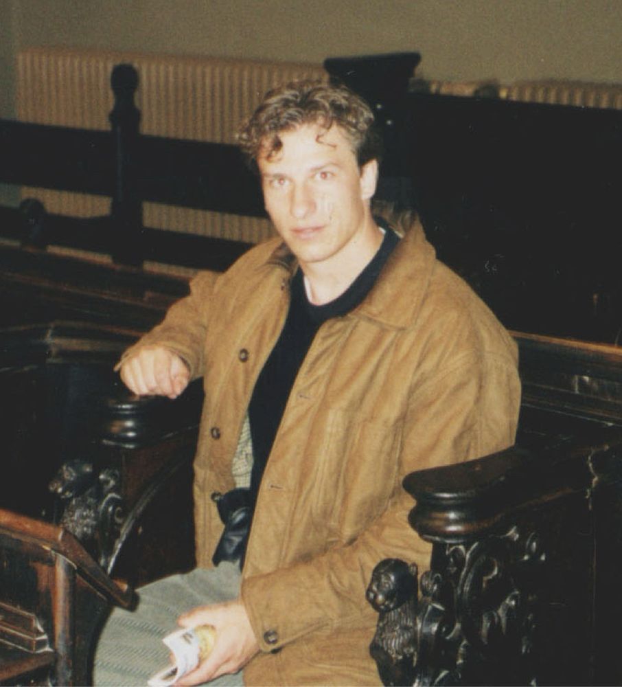 Farm boy sitting in pew in Schloss Burg church in Solingen, Germany in late ‘90s..