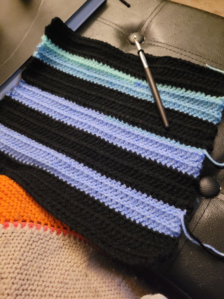 BLO HDC stripes - some black, the rest are color changing starting with light blue into light pale green 