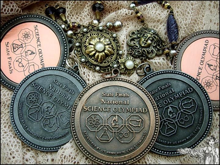A bevy of vintage Science Olympiad medals, earned by a weird little goth girl once upon a time. (photo: Kambriel)