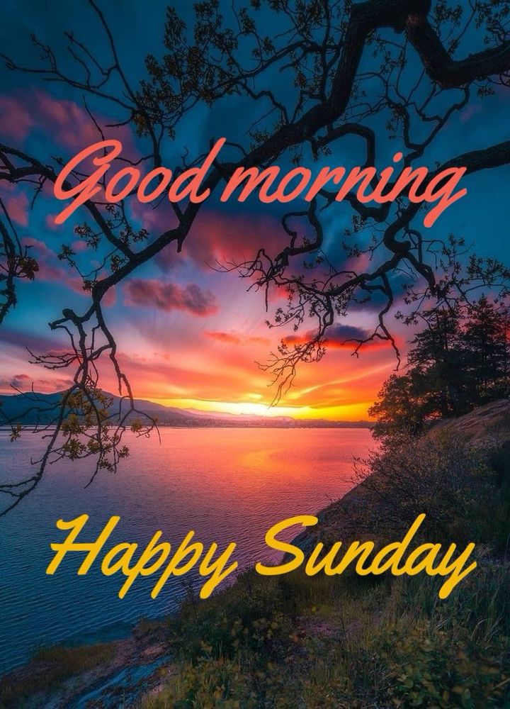 Sun rising over mountains and a lake