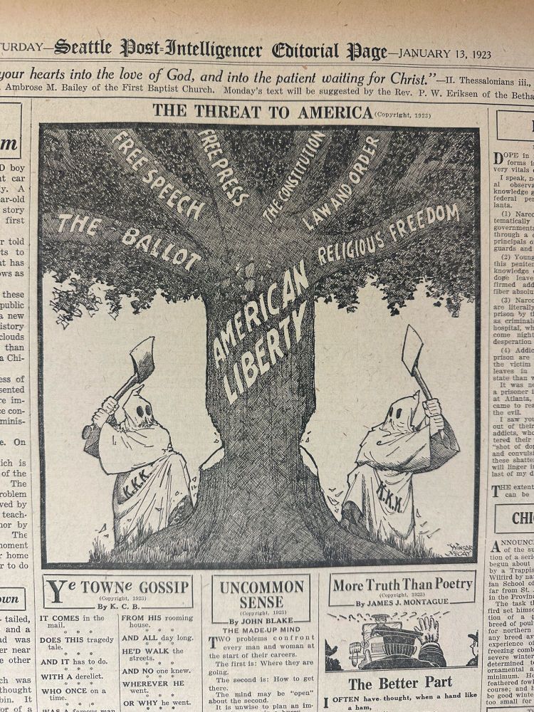 Political cartoon depicting two people in white hoods and robes labeled “KKK” standing on either side of a tree labeled “American Liberty” on its trunk.  The two people are chopping into the trunk with axes.  Branches of the tree are labeled “The Ballot,” “Free Speech,” “Free Press,” “The Constitution,” “Law and Order,” and “Religious Freedom.”