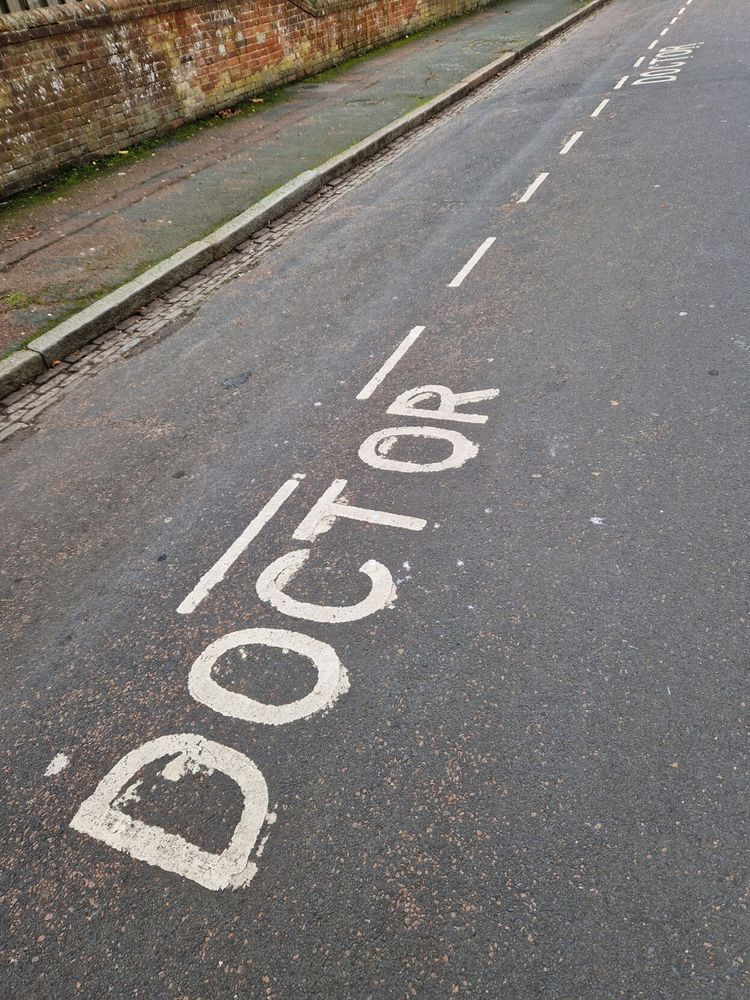 DOCTOR DOCTOR markings on Road