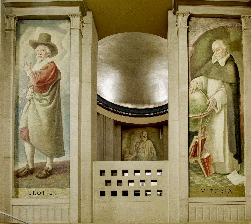 ‘Hugo Grotius (1583-1645) - A Dutch jurist & humanist...the “father of international law.” In 1625, he wrote the 3-volume De Jure Belli ac Pacis (On the Law of War & Peace),...one of the earliest definitive texts on international law, along with those of Alberico Gentili & Francisco de Vitoria, pictured to the right of Grotius. Robinson depicted Grotius along a shoreline gesturing toward a departing ship, suggesting the global reach of his legal writings.’
‘Francisco de Vitoria (1480-1546) – A Spanish Dominican friar & legal scholar...was one of the founders of modern international law & was known for defending the legal rights of American Indians. ... Robinson based this portrait on [Scott]... Upon viewing the mural, Scott wrote to Robinson, “Words fail me to express my appreciation of the magnificent mural of Francisco de Vitoria...[F]rom the bottom of his heart the unworthy one whose likeness likeness Vitoria bears...thanks you for the most perfect portrait he has ever had.”’
