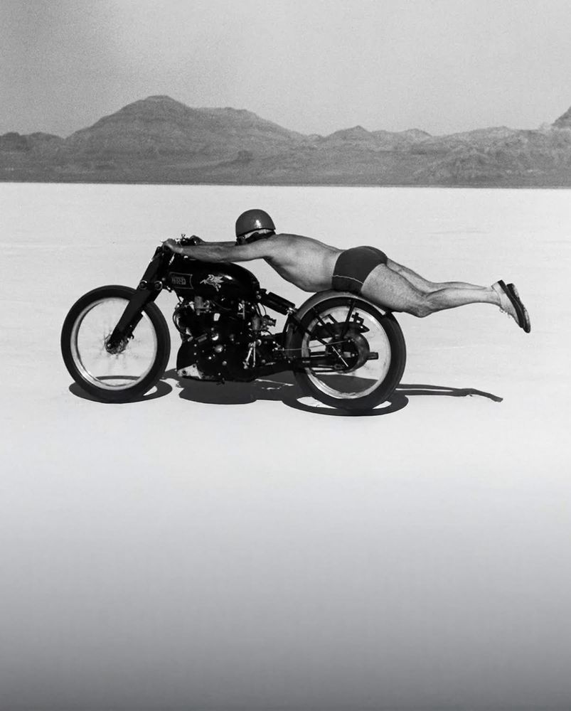 Rollie Free setting a US motorcycle speed record at Bonneville Salt Flats in 1948. His leathers were damaged, so to minimise drag he rode his Vincent Black Lightning in his swimming trunks... at 150mph.