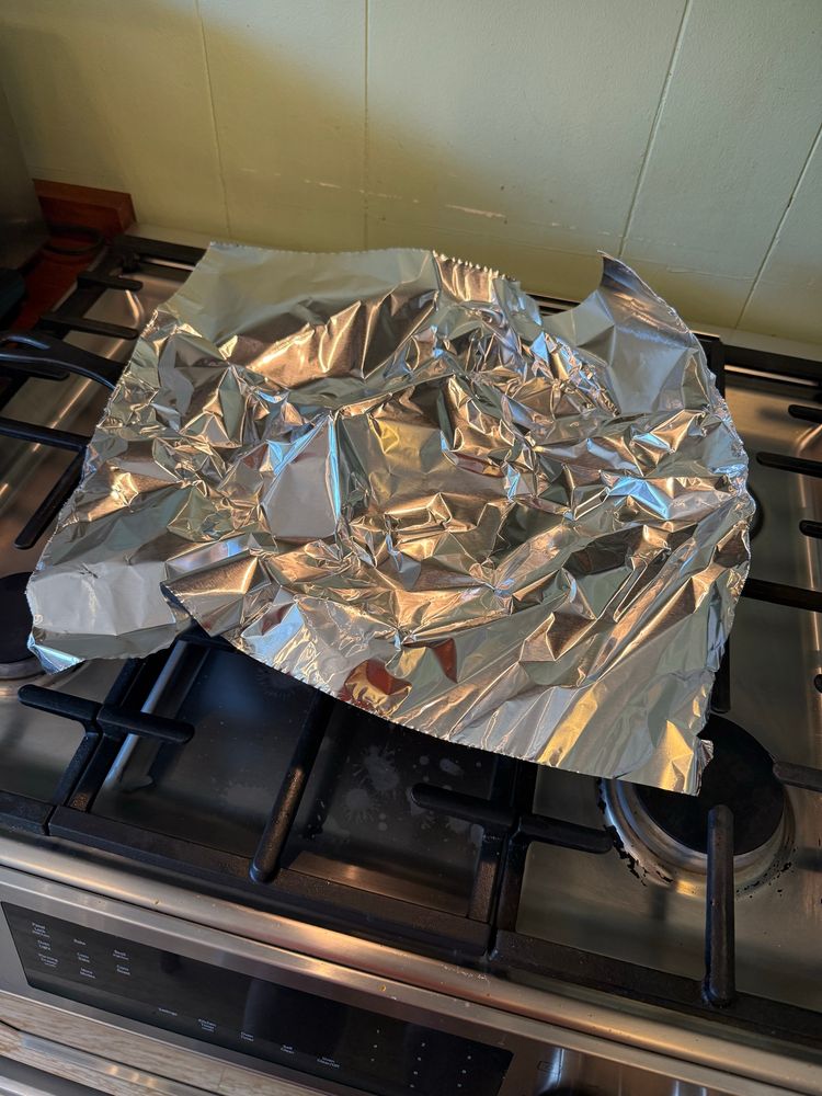 A big ass cast iron pan covered by a single piece of the big foil