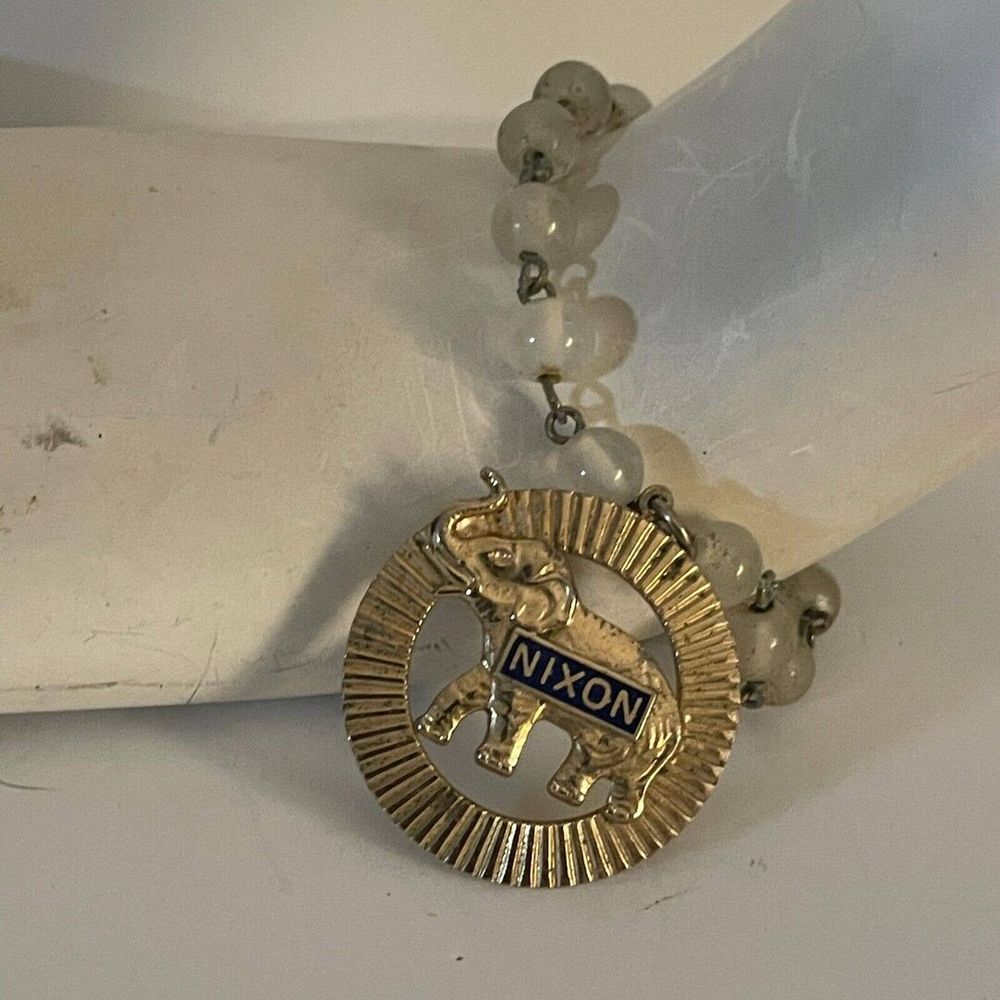 Beaded bracelet with Nixon charm