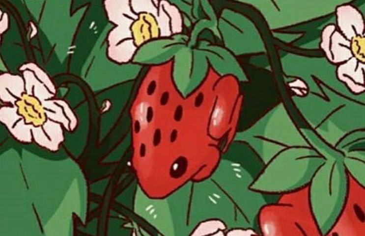 A red frog speckled with black spots to look like a strawberry is hanging from a vine