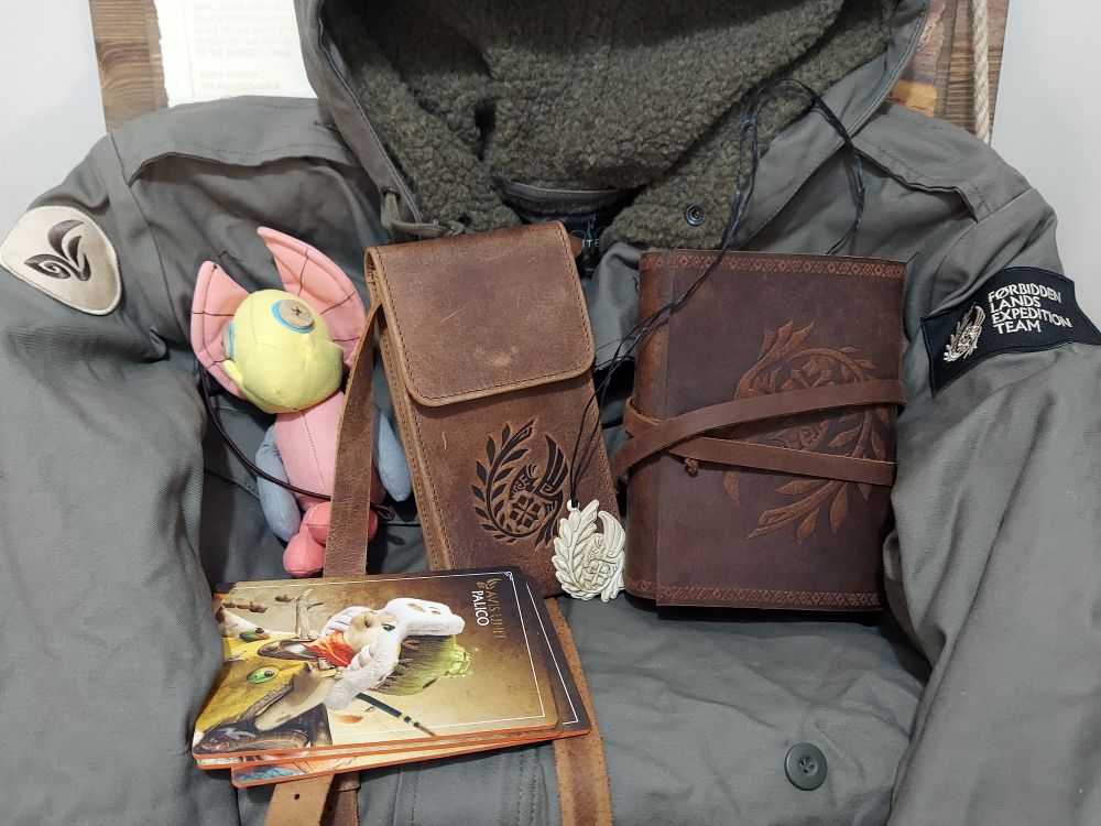 A kut ku plushie, journal, necklace, and pouch!