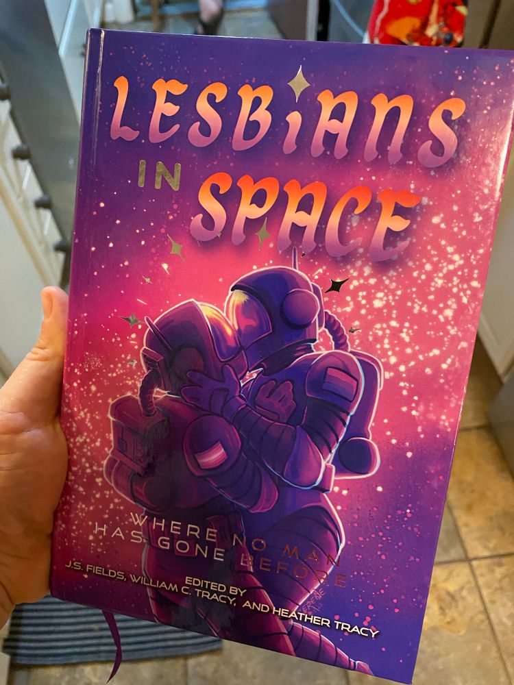 A photo of the gorgeous cover of the book Lesbians in Space: Where No Man Has Gone Before.