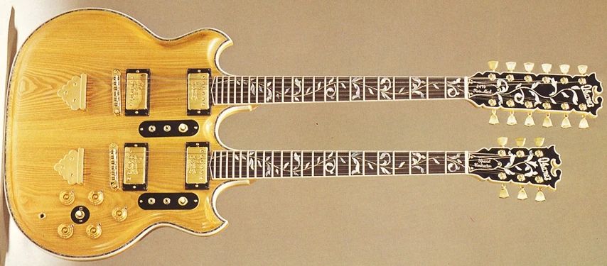 The Ibanez 2670 Artwood Twin is an extremely fancy 12/6 doubleneck guitar from the late 1970s. It's kinda shaped like the Bob Weir signature model they had around the same time, and has a German carve around the body and tree-of-life inlays covering the neck and headstock just like Bob's top-of-the-line model. Each neck has a bank of three switches below the strings: a 3-way switch to choose what pickup you're playing, and a 3-way Tri-sound coil tap/series/parallel switch for each pickup. Each neck also has a volume and an tone control, and there's also a 3-way neck selector switch and a master volume control.

This guitar 