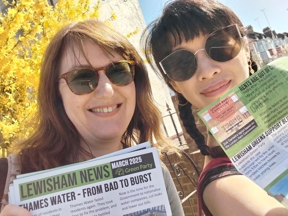 Cllr Tam and local member Claire holding up the Lewisham Greens March 2025 newsletter, which they delivered in Ladywell today