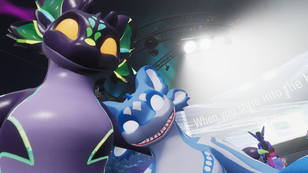 Taking a selfie with both myself and @itsarman.fursona.club in our Malestrorca avatars at Stage Flight 2.5 as the lights blind the background out.