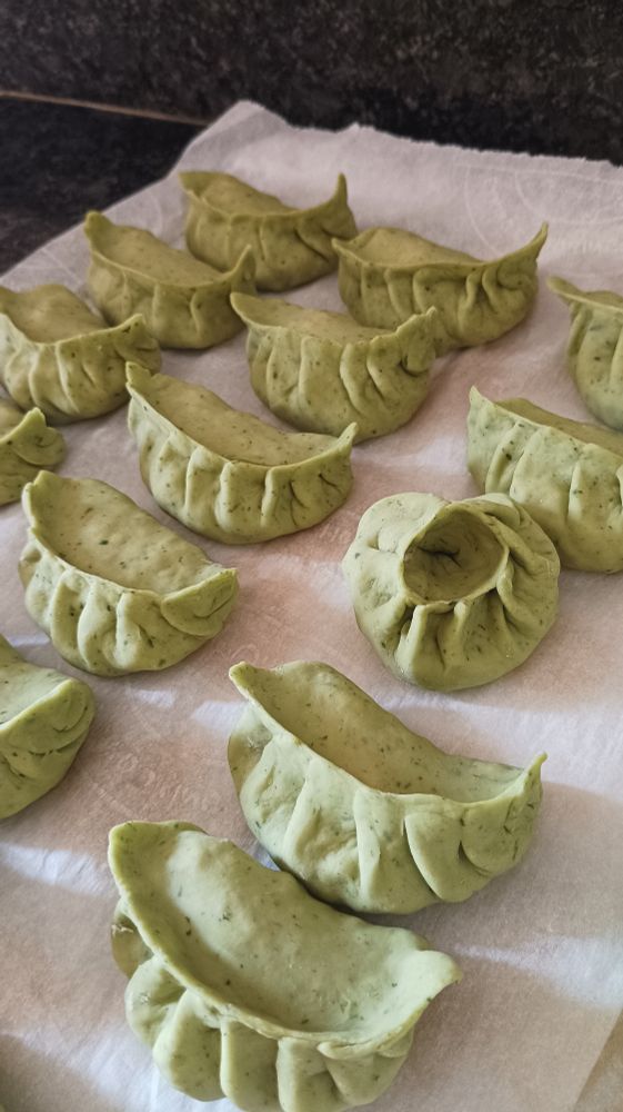 A different angle of the dumplings, there is one folded differently. 