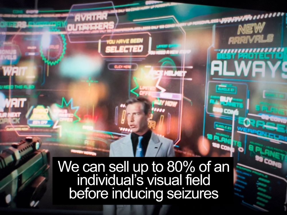 Nolan Sorrento, the antagonist of Ready Player One, stands in front of a display almost completely covered in sample advertisements. captioned "We can sell up to 80% of an individual's visual field before inducing seizures"