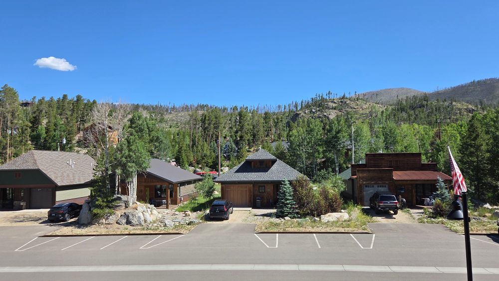 Small houses with mountains in the background
