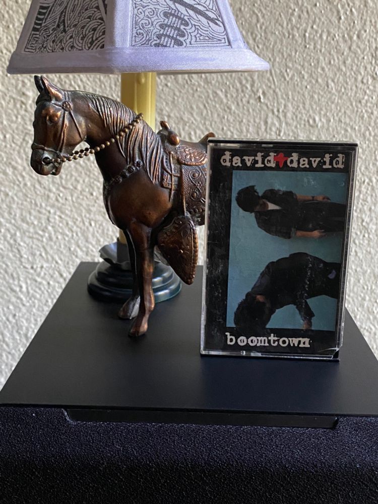 David & David • Boomtown • 1986 cassette on top of a speaker next to a little horse and a little lamp
