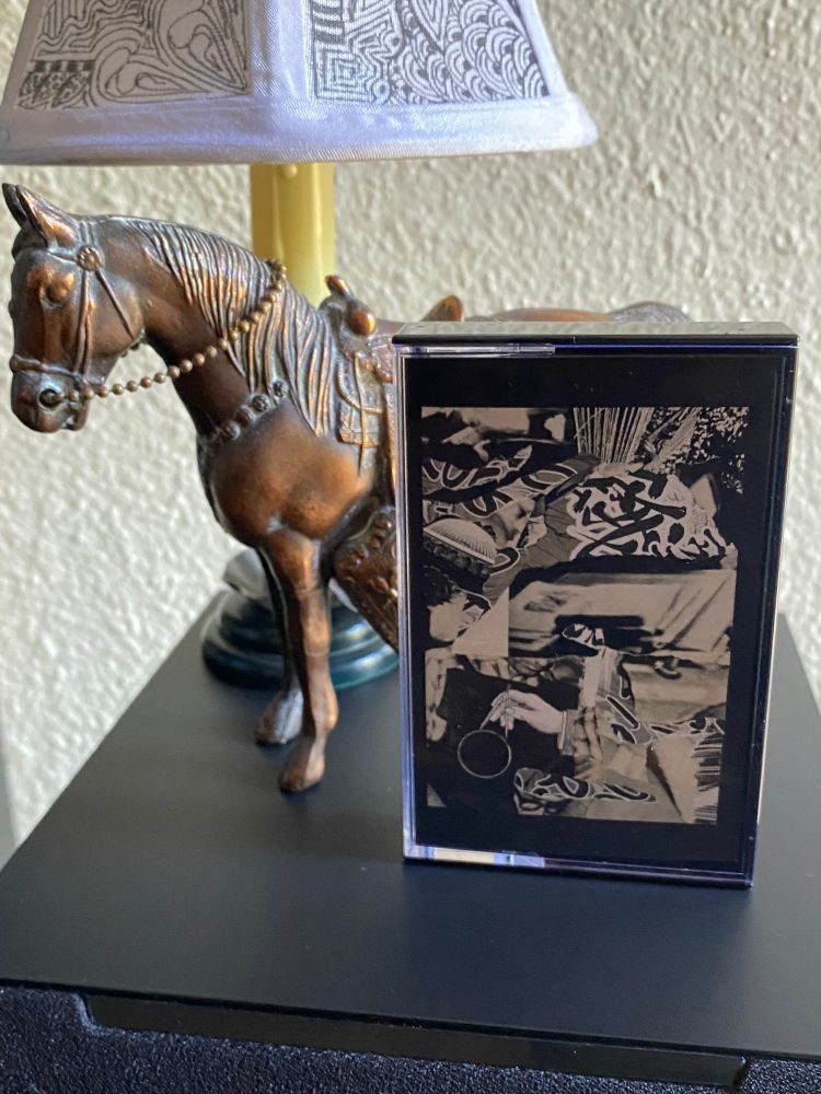 Bottlecap Mountain • Everest • 2025 cassette on top of a speaker by a little horse and a little lamp
