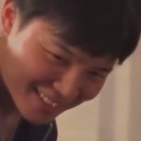 zoomed in face of jimin of bts in which he smiles very wide