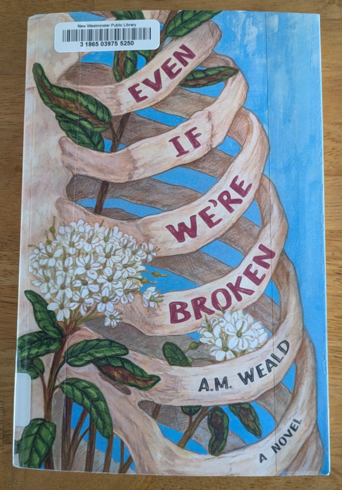 Cover of Even if we're broken by A.M. Weald. It shows a ribcage with flowers on a blue background.