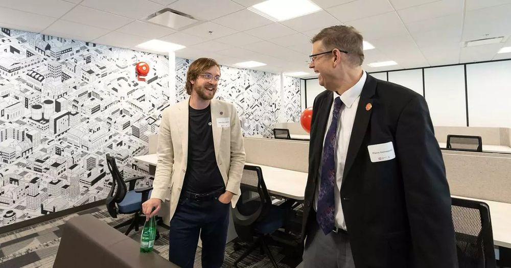 Quantum City Scientist-in-Residence, Adam Bene Watts conversing with UCalgary Associate Dean, Community and Innovation, Pierre Kennepohl.