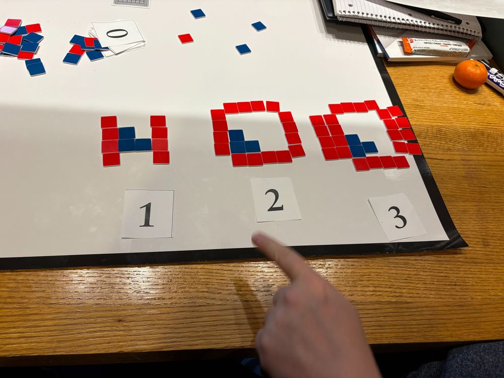 A growing pattern with red and blue tiles