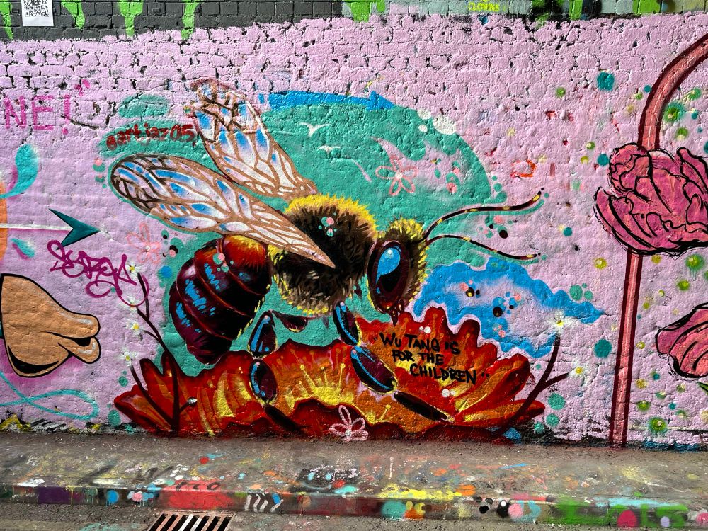 Graffiti of a colourful bee. 