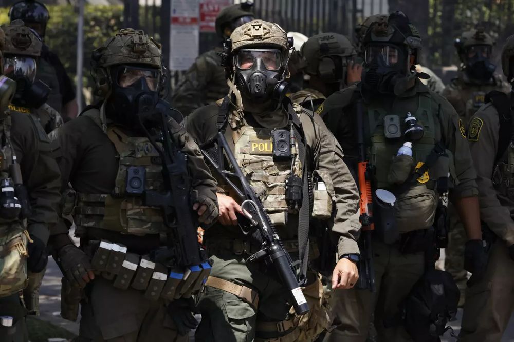 Police in tactical gear.