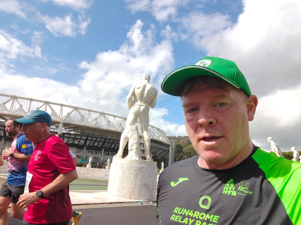 Me running with big Italian statue behind me with a fine arse on it. 