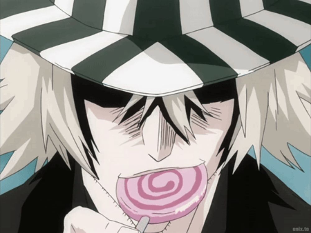 a man in a striped hat is eating a lollipop