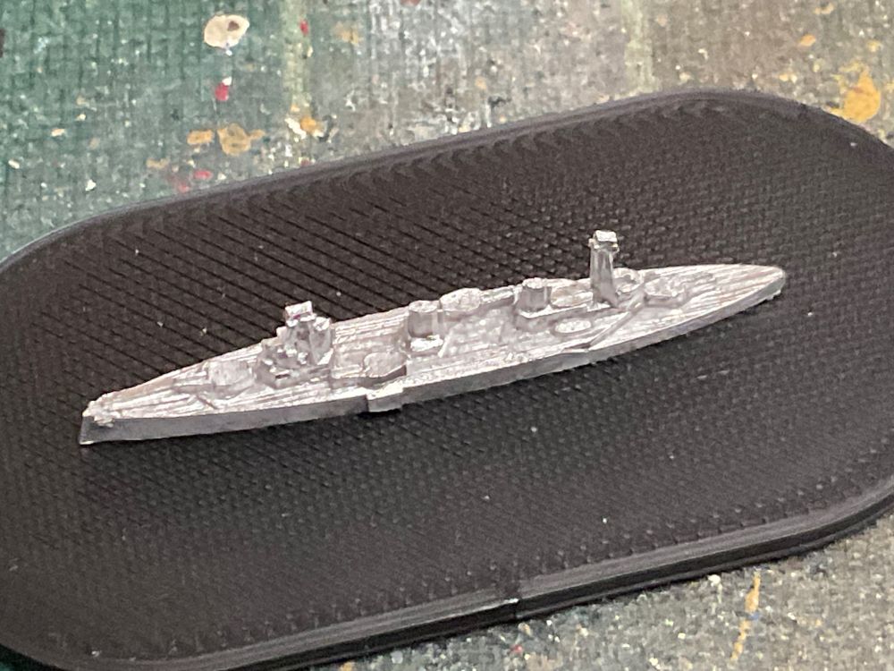 Close up of a 1/4800 scale metal Indefatigable class battlecruiser model mounted on a black 3D printed base (base size 60mm x 30mm)
