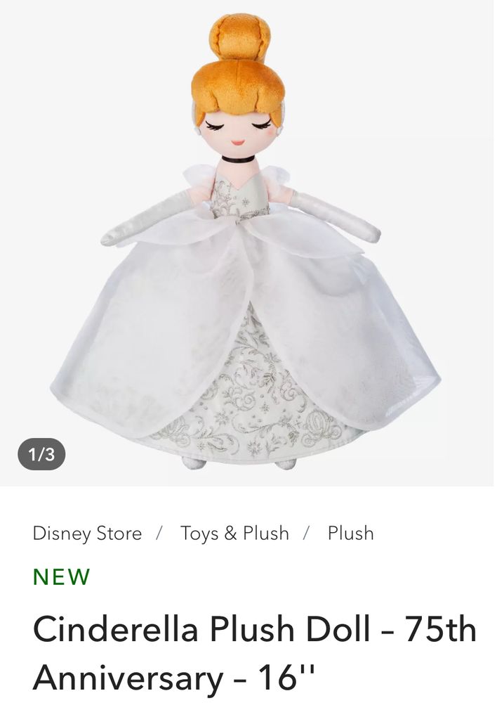 Screenshot of a new 16” Cinderella plush doll on the Disney Store website with strawberry blond hair and a silver dress with sparkly detailing 

