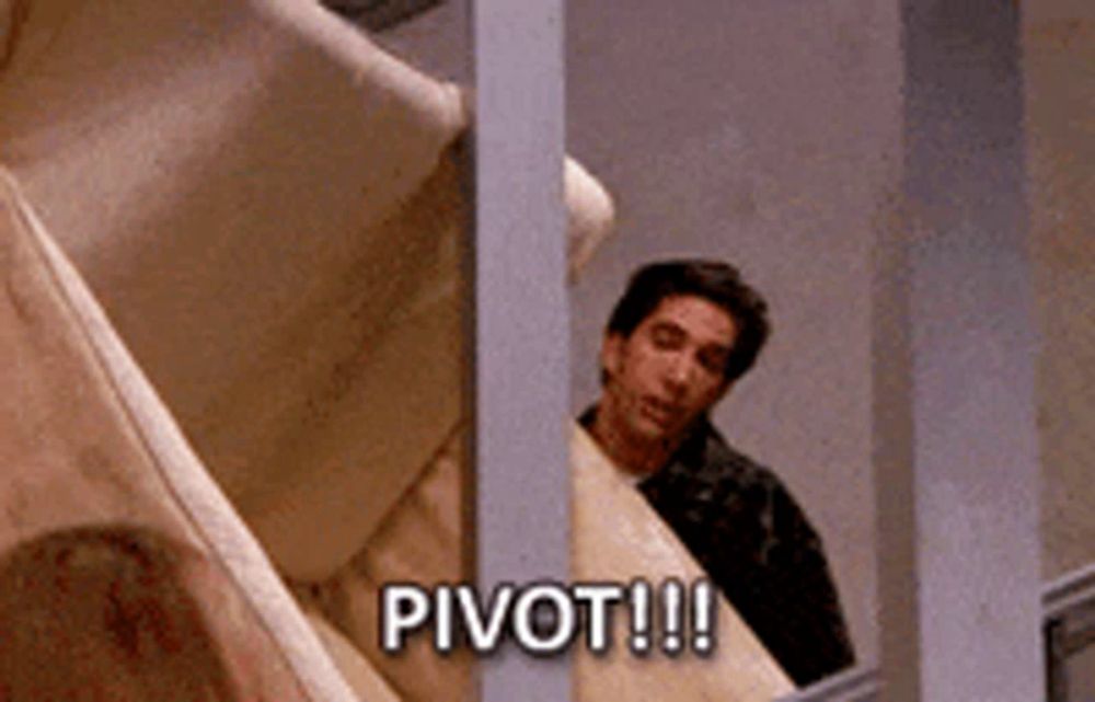 a man is peeking out from behind a railing and says pivot