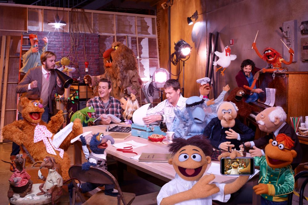The Muppets in a photo shoot for "The Muppets" (2011) with co-star Jason Segel, director James Bobin, writer Nicholas Stoller, and songwriter Bret McKenzie