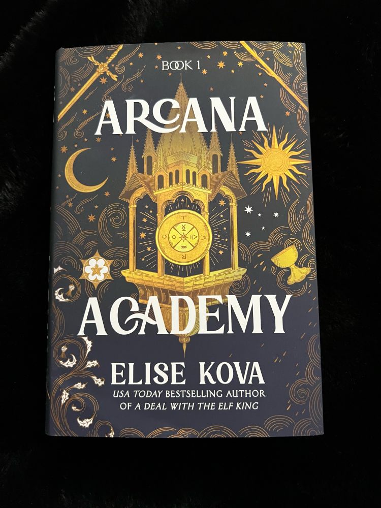 A copy of Arcana Academy by Elise Kona laying on a black background:
