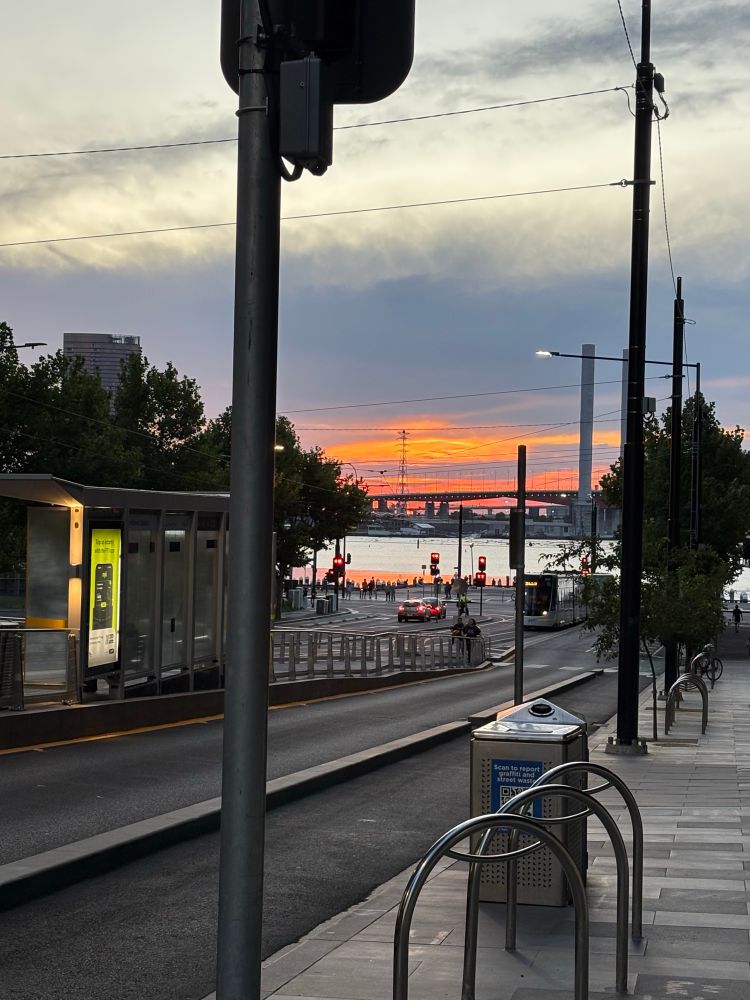 A vivid orange and pink sunset over Port Phillip Bay at Docklands, Melbourne.