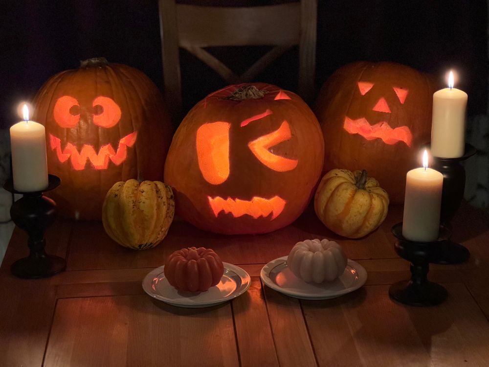 Three carved pumpkins, which were carved by myself, my daughter, and my wife respectively. Also a couple of much smaller pumpkins, and some candles and pumpkin decorations.