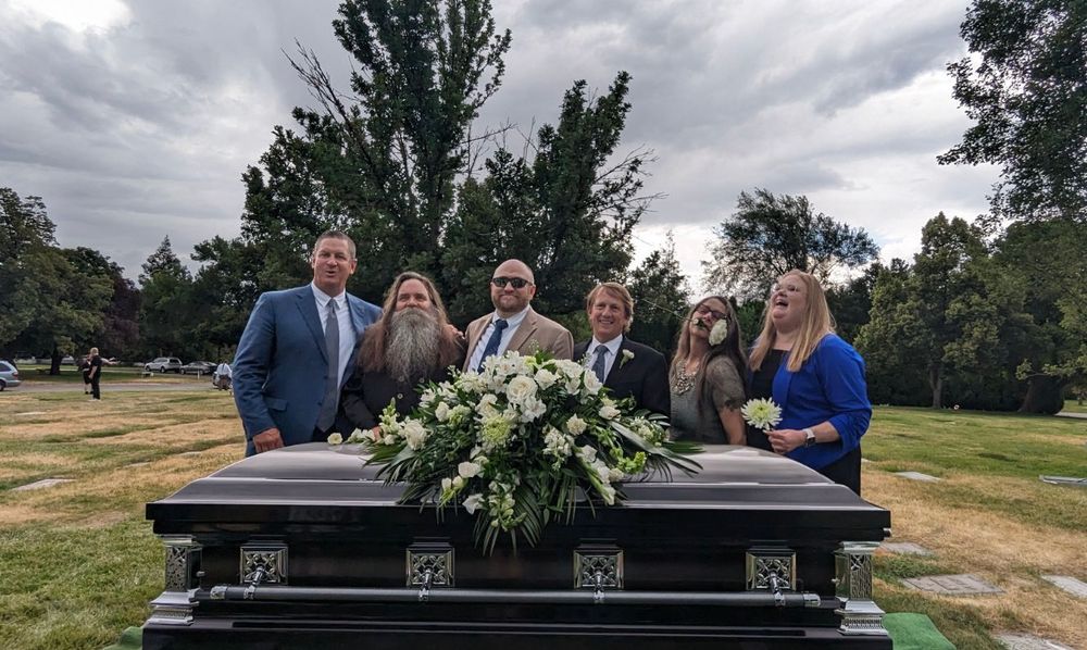 Brothers and sisters in front of Dad’s casket August 2024. 
