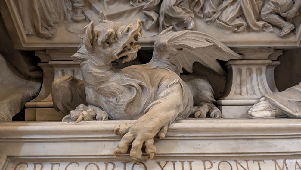 a photo of a white marble(?) dragon statue