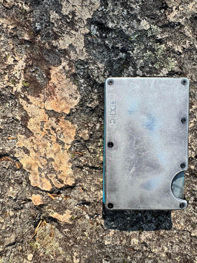 Patch of preserved, incredible smooth (glassy!), glacially polished surface on granitic bedrock of Acadia Mountain, Acadia National Park.