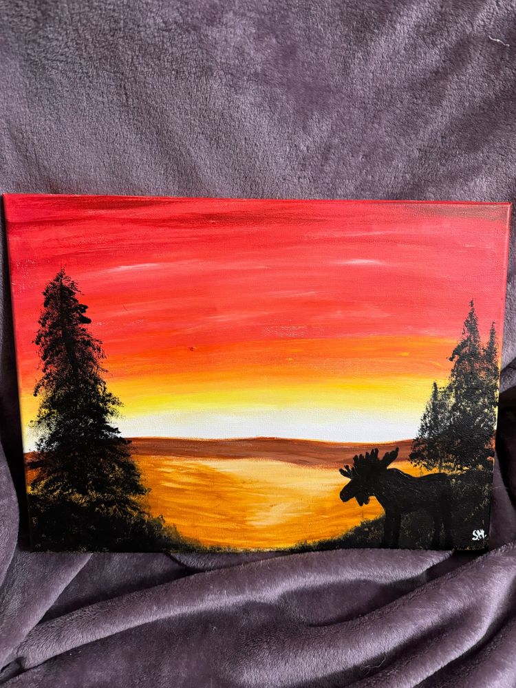 An acrylic painting I did earlier this year at a paint night with coworkers. It is a sunset scene with trees and the silhouette of a moose.