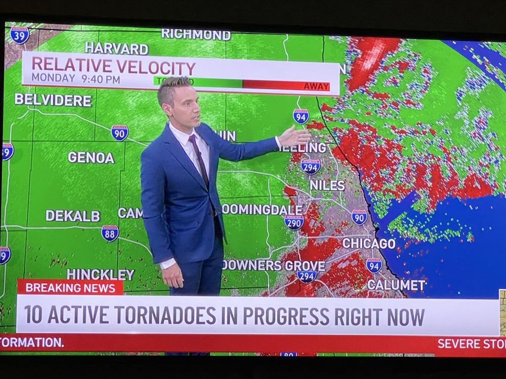 Weatherman standing in front of graphic of Chicago area with the chyron "10 active tornadoes in progress right now"