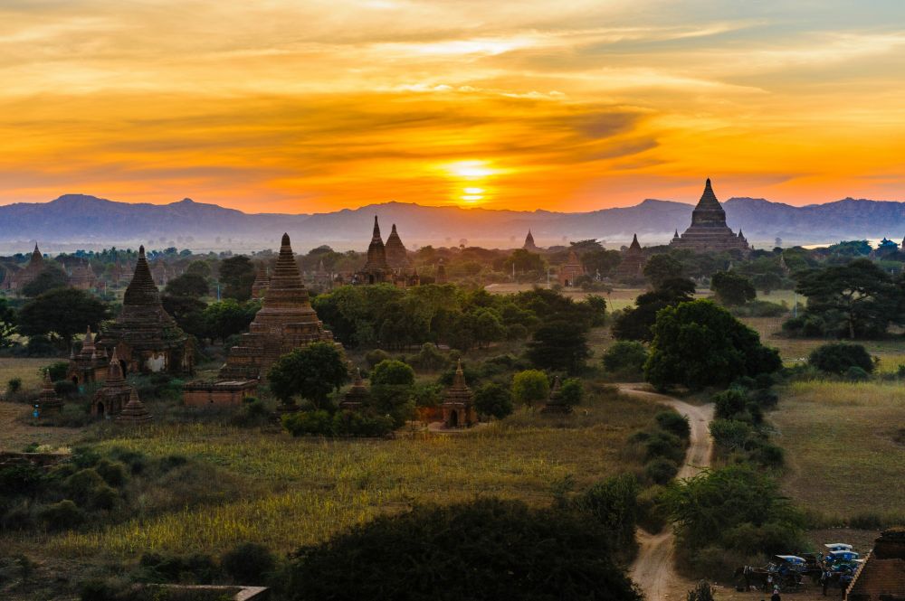 A sunset in Myanmar. Photo by Alexander Schimmel via Unsplash