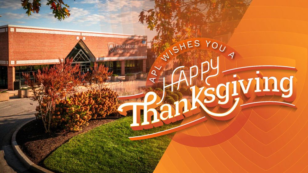 APL building exterior with fall foliage, accompanied by a festive message on an orange gradient background saying 'APL wishes you a Happy Thanksgiving.'