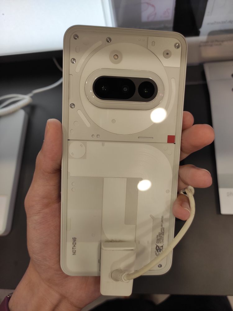 Nothing Phone 3a in white. It looks like a typical Nothing Phone with this colour. Like the Phone 2a, the Phone 3a's Glyph interface has lesser LEDs than Phone 1 and Phone 2. This is gonna be fun to try if I have money to burn.