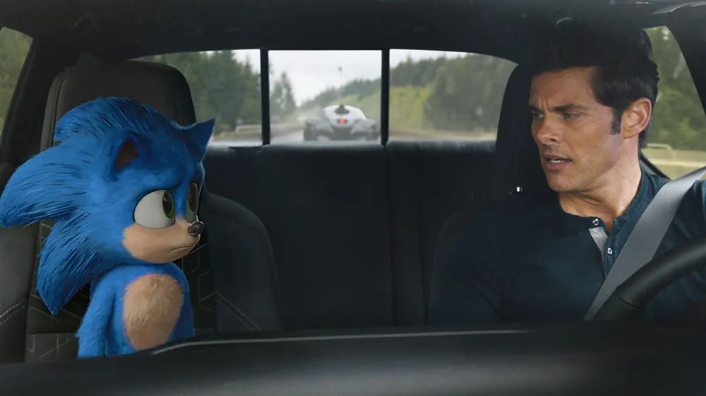 Sonic and James Marsden looking at each other in the car in the Sonic Movie